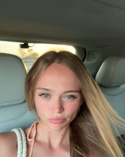 Kyla Dodds in blue bikini embracing summer vibes.