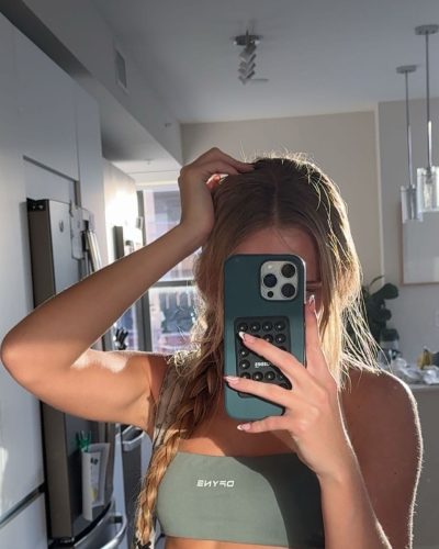 Kyla Dodds sporty sneakers with gray high-waisted shorts