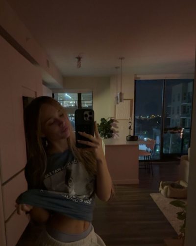 Kyla Dodds gray crop top and sporty sneaker pairing