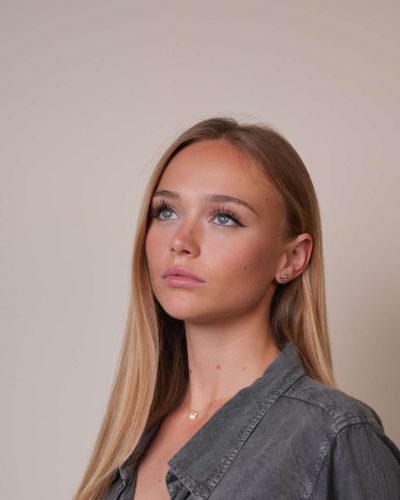 Kyla Dodds dressed in black tank and comfortable shorts.