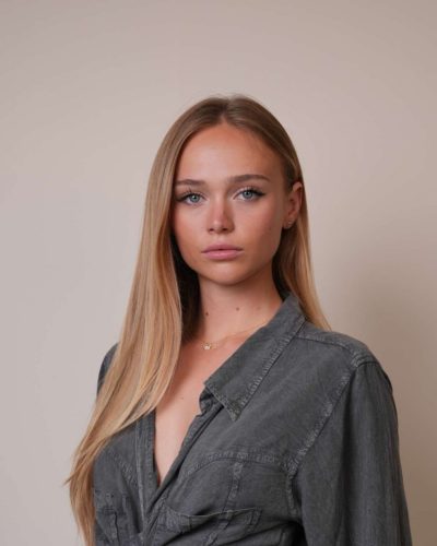 Kyla Dodds in casual black tank and fitted shorts.
