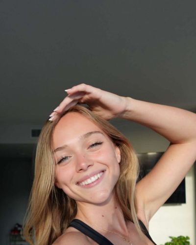 Kyla Dodds wearing black fitted tank top and shorts.