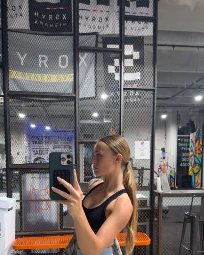 Kyla Dodds in black tank top and black shorts.