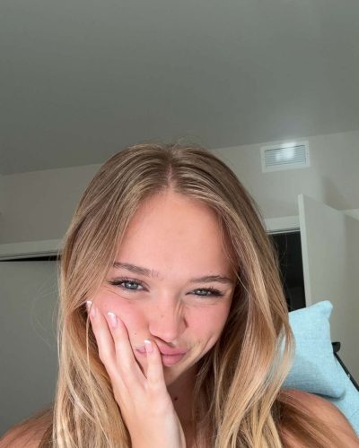 Kyla Dodds styled in white tank top and casual shorts