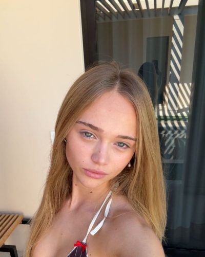 Kyla Dodds in trendy brown striped bikini and cover-up.