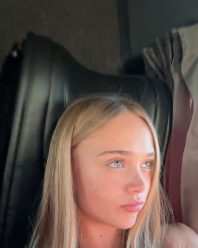 Kyla Dodds in beach-ready brown striped bikini outfit.