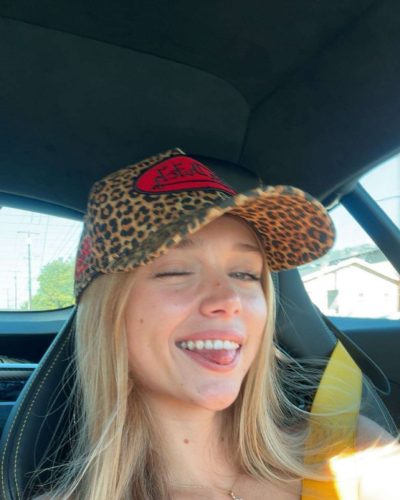 Kyla Dodds in casual black top and comfortable blue shorts