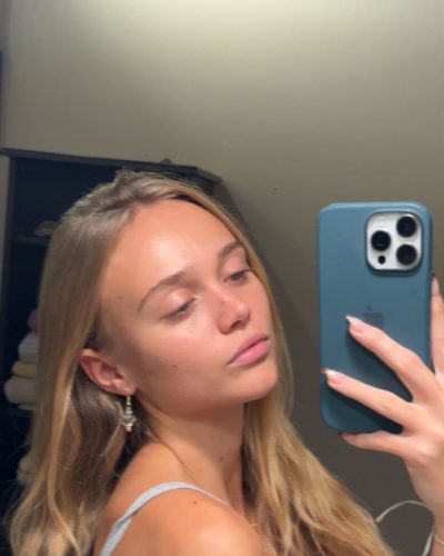 Kyla Dodds in sleek black top and vibrant blue shorts