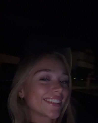 Kyla Dodds wearing black racerback and chic blue shorts