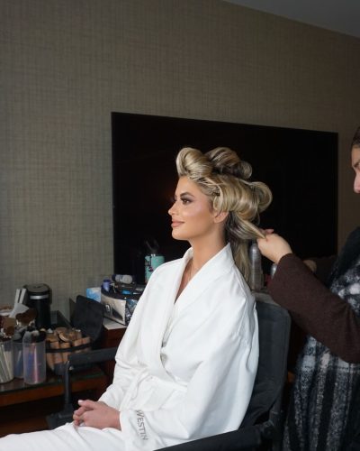 Kylan Darnell black floral bikini paired with stylish round sunglasses