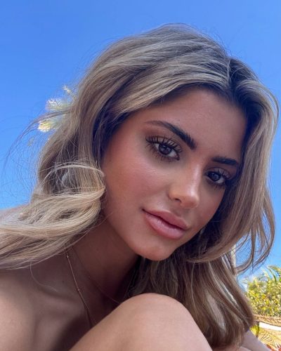 Kylan Darnell floral bikini in black with round sunglasses