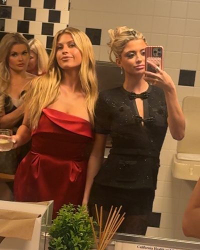 Kylan Darnell black bikini featuring floral accents and straw hat