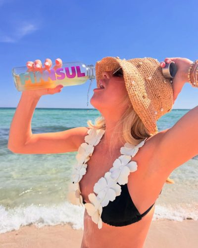 Kylan Darnell black bikini with floral design and retro sunglasses