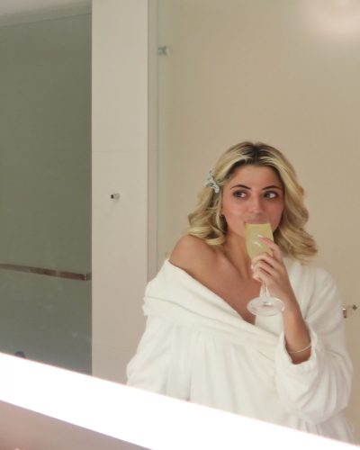 Kylan Darnell black floral bikini and wide-brimmed straw hat