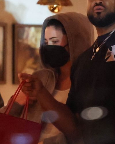 Kylie Jenner gray sweatshirt and fashionable handbag