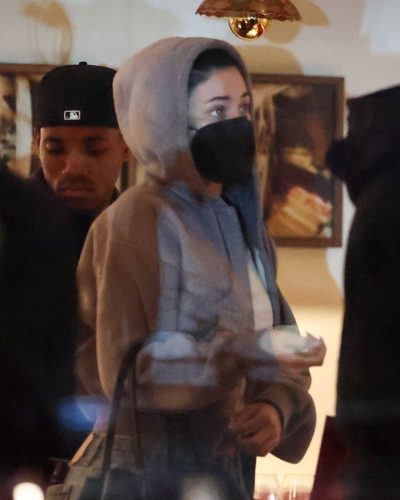 Kylie Jenner gray sweatshirt and trendy handbag