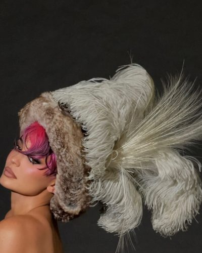 Kylie Jenner featuring tailored yellow jacket and statement necklace