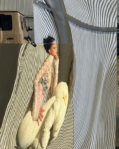 Kylie Jenner wearing vibrant yellow ensemble with chunky necklace