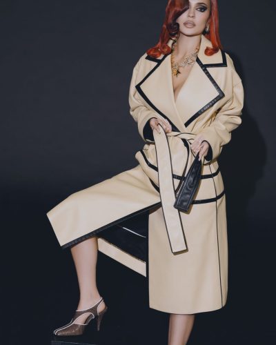 Kylie Jenner in bold yellow tailored jacket with warm tones