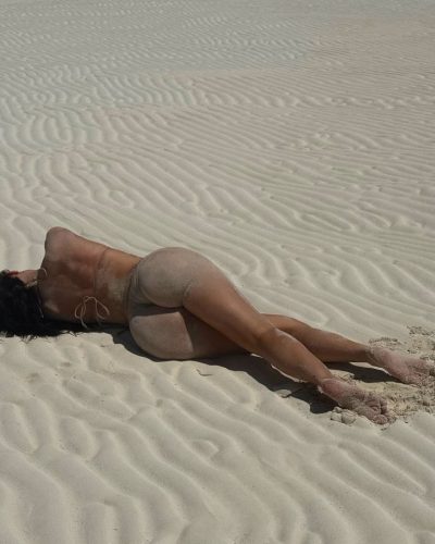 Kylie Jenner in casual beige bikini enjoying the sun.