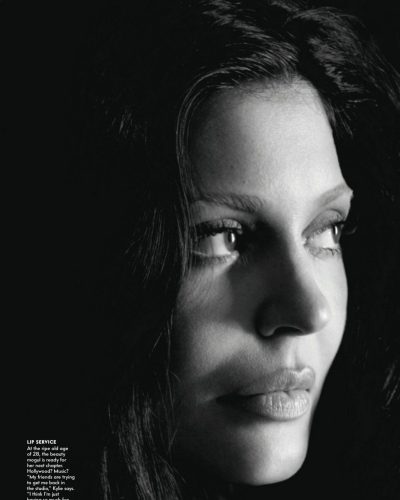 Kylie Jenner sleek black bra paired with high-waisted trousers