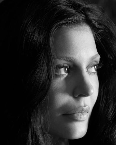 Kylie Jenner stylish black bra and tailored beige trousers