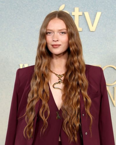 Larsen Thompson in stylish maroon suit and black accessories