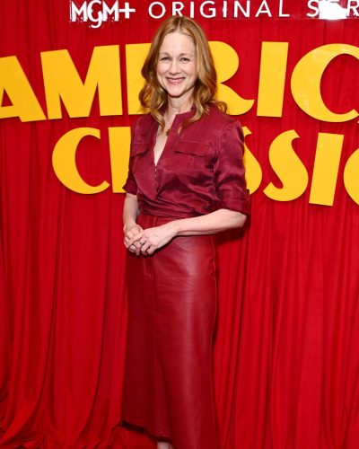 Laura Linney fitted red shirt and stylish leather skirt