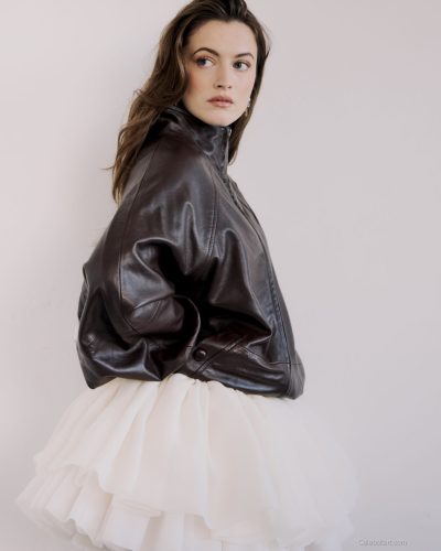 Lauren McQueen in lightweight cream gown with subtle sheen