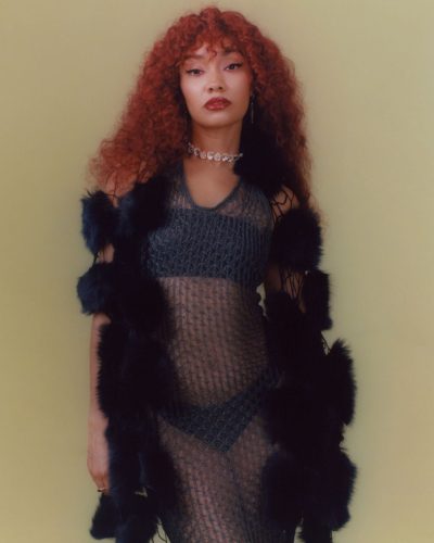 Leigh-Anne Pinnock in bright yellow gown with stylish high heels