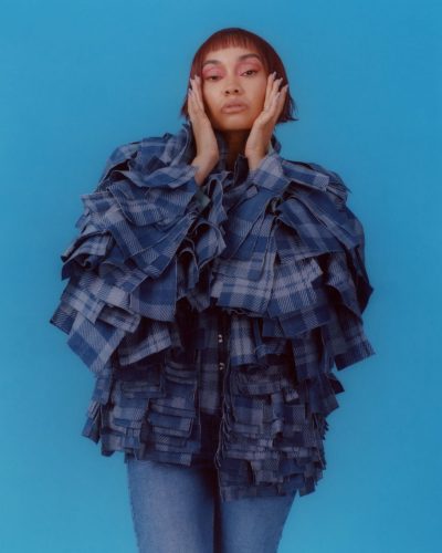 Leigh-Anne Pinnock in chic yellow dress with elegant silhouette