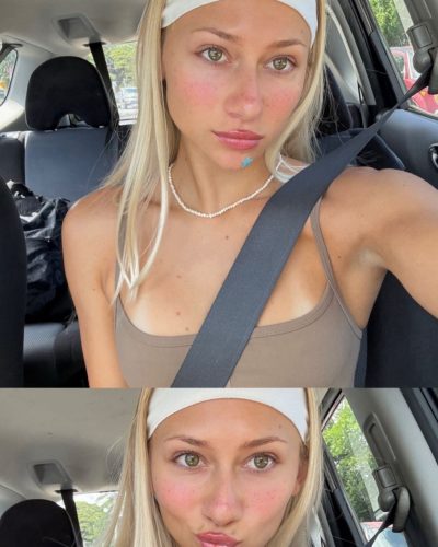 Leila Faler in playful bikini with bright colors by the waves.