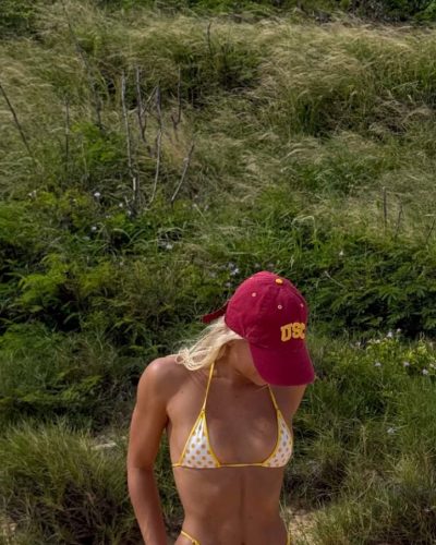 Leila Faler in casual red hat and yellow bikini