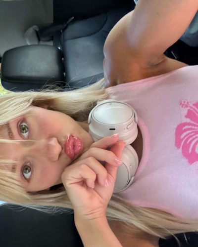 Leila Faler wearing a white top paired with shorts