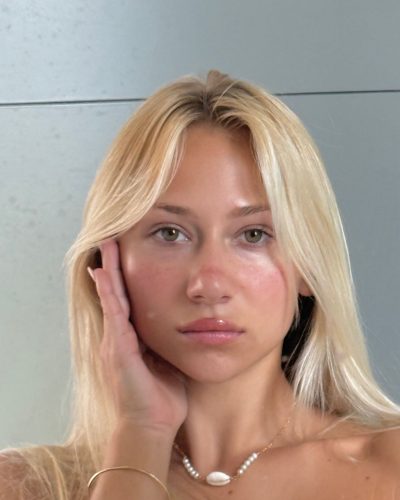 Leila Faler in a white summer outfit with ties