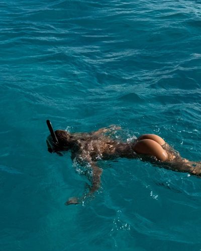 Leila Faler wearing a white crop top with loose ties