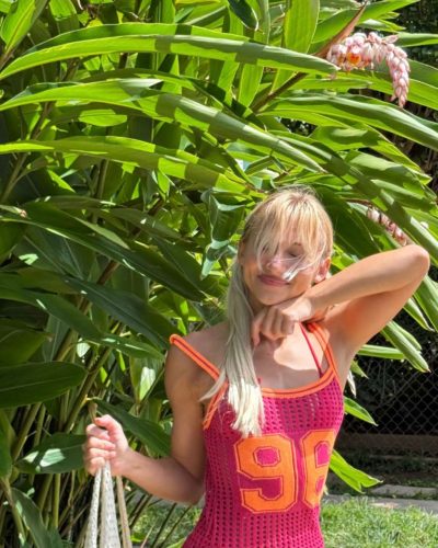 Leila Faler wearing a white crop top with loose ties