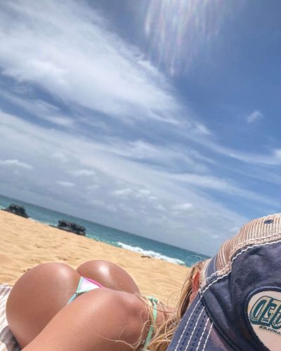 Leila Faler in a white top with relaxed fit shorts