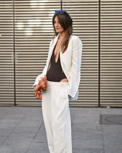Leila George in brown bodysuit paired with wide-legged trousers