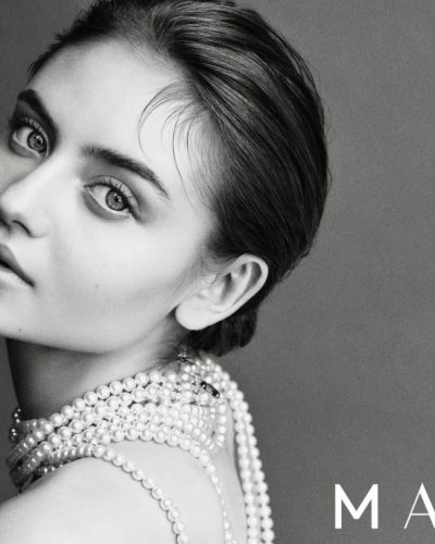 Leni Klum wearing simple bold attire with pearl necklace