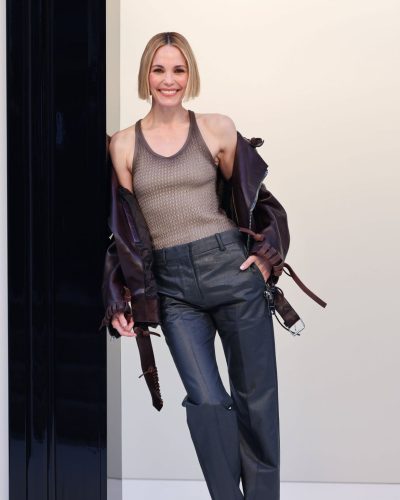 Leslie Bibb brown leather jacket and sophisticated tailored trousers.