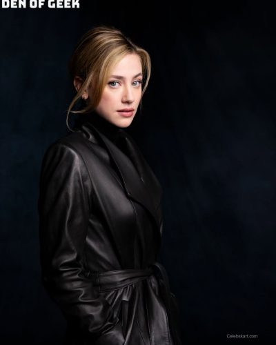 Lili Reinhart in sleek black leather coat with structured silhouette.