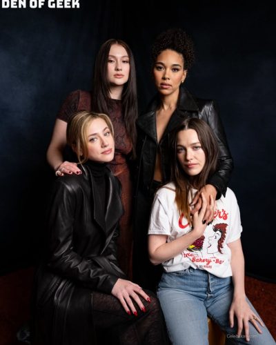 Lili Reinhart wearing structured black leather coat and turtleneck.