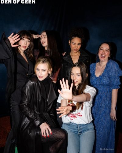 Lili Reinhart in black leather coat with cozy turtleneck underneath.