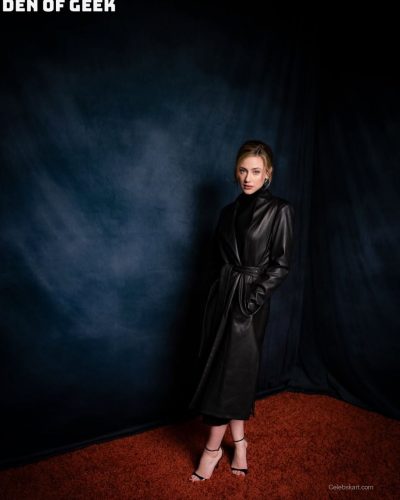 Lili Reinhart in fitted black turtleneck and chic leather coat.