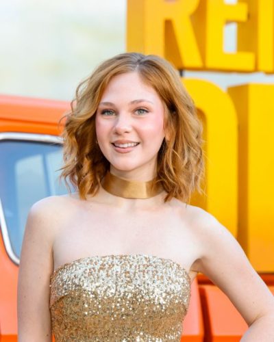 Lily Brooks O'briant vibrant gold gown with sophisticated accents