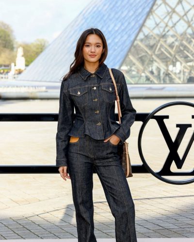 Lily Chee in structured denim jacket and fitted trousers