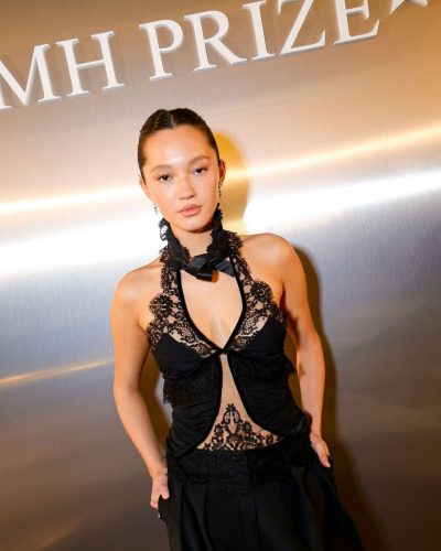 Lily Chee in black lace top and tailored black pants