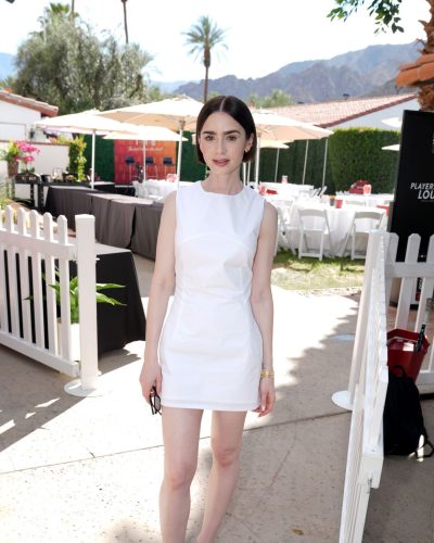 Lily Collins in a fitted white dress and casual black flip-flops
