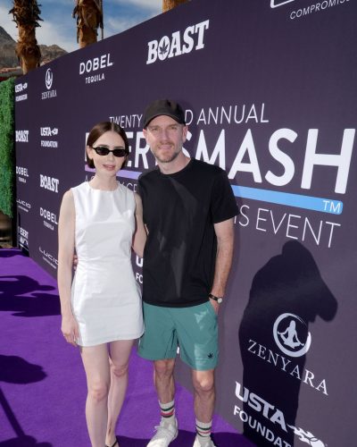 Lily Collins in a trendy white dress with black sandals